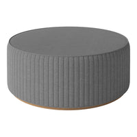 Round gray ottoman with vertical ribbed texture and a natural wood base. Perfect for modern decor.