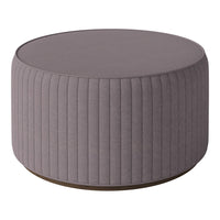 Round gray ottoman with vertical ribbed texture and a smooth top, perfect for modern decor.