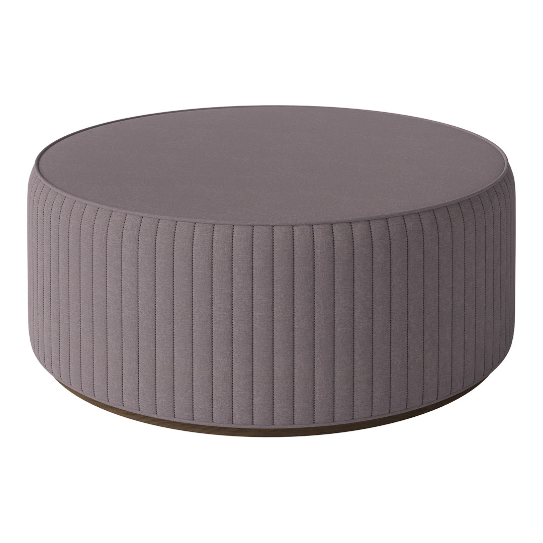 Round purple ottoman with ribbed texture and a wooden base, ideal for modern decor.