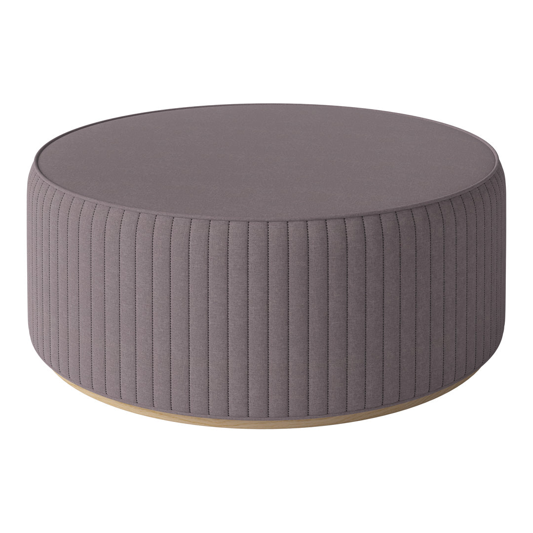Round gray ottoman with vertical ribbed texture and a smooth wooden base, perfect for modern decor.