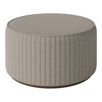 Round beige ottoman with vertical ribbed texture and wooden base, perfect for modern living spaces.