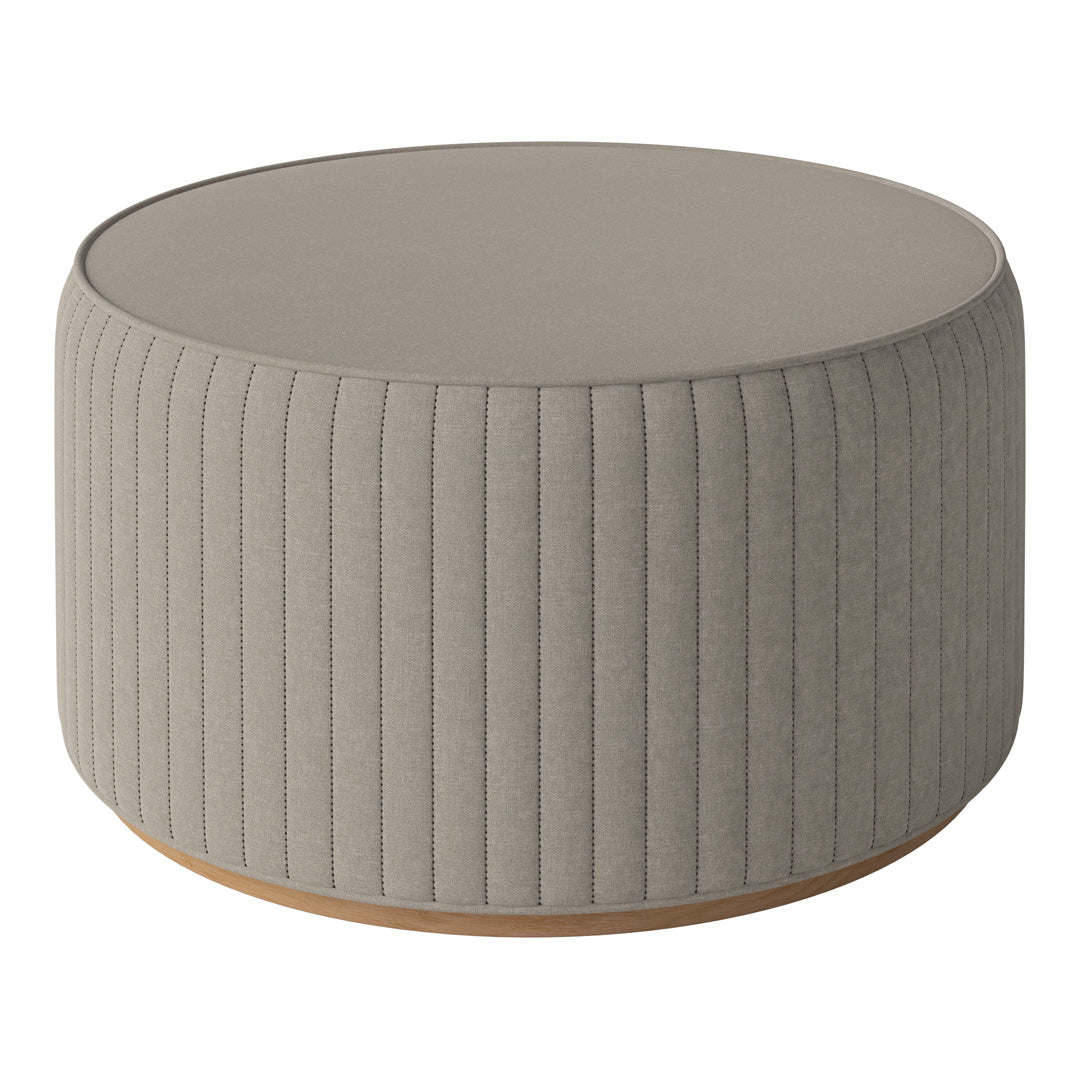 Light gray round ottoman with vertical ribbed texture and wooden base. Ideal for modern home decor.
