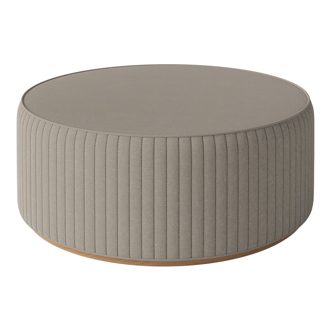 Round gray ottoman with vertical ribbed pattern and a wooden base, perfect for modern living spaces.