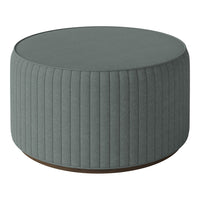 Round tufted pouf in soft gray with vertical ribbed pattern and wooden base, perfect for modern decor.