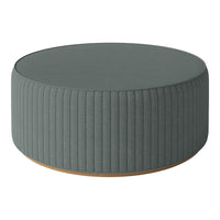 Gray ribbed round ottoman with a smooth top and subtle wooden base, perfect for contemporary decor.