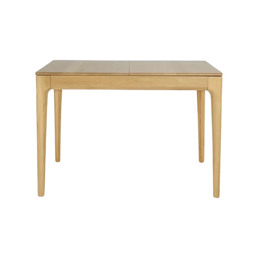 Light oak table with a smooth finish and minimalist design, featuring natural wood grain patterns.