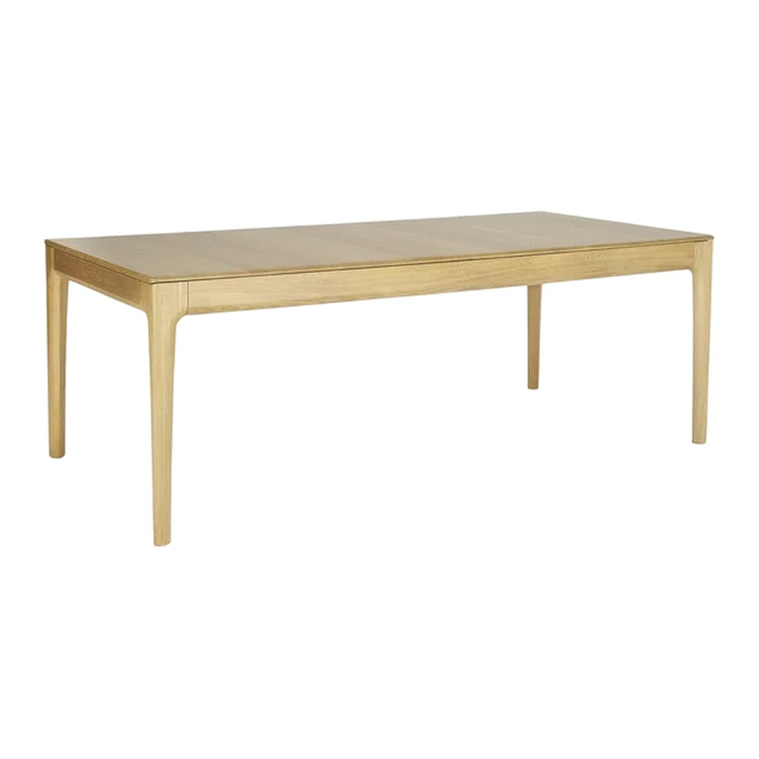 Natural wood finish dining table with smooth, light beige surface and sleek, minimalist design.