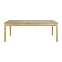 Light oak dining table with a smooth, minimalistic surface and soft, rounded edges. Elegant natural wood finish.