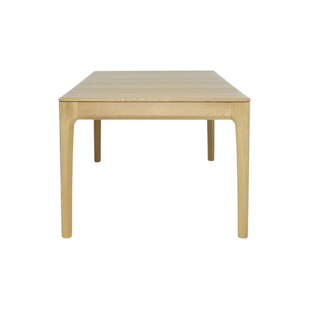 Light natural wood dining table with a smooth, matte finish and clean, simple lines. Perfect for modern decor.