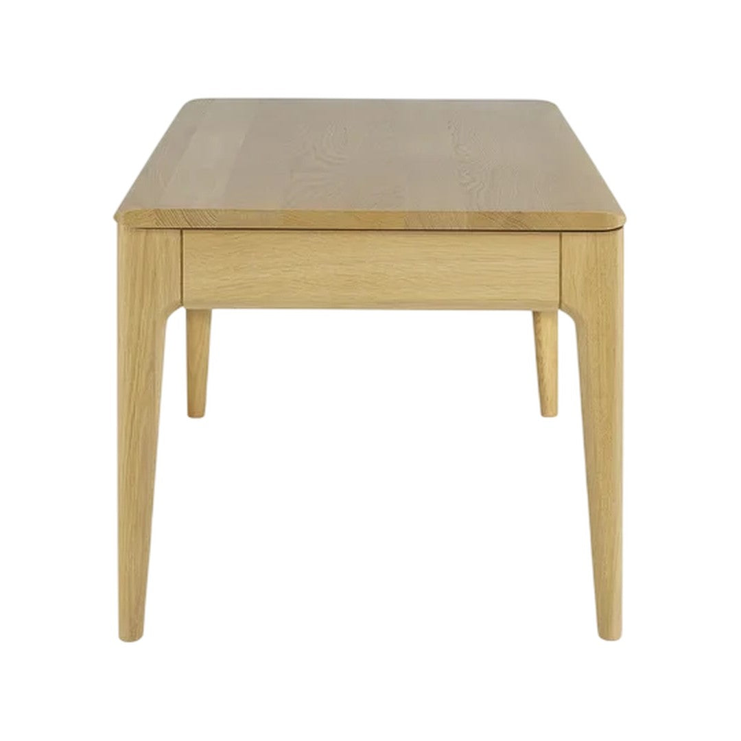 Light oak wood coffee table with a smooth, natural finish and clean lines. Contemporary design with sleek legs.