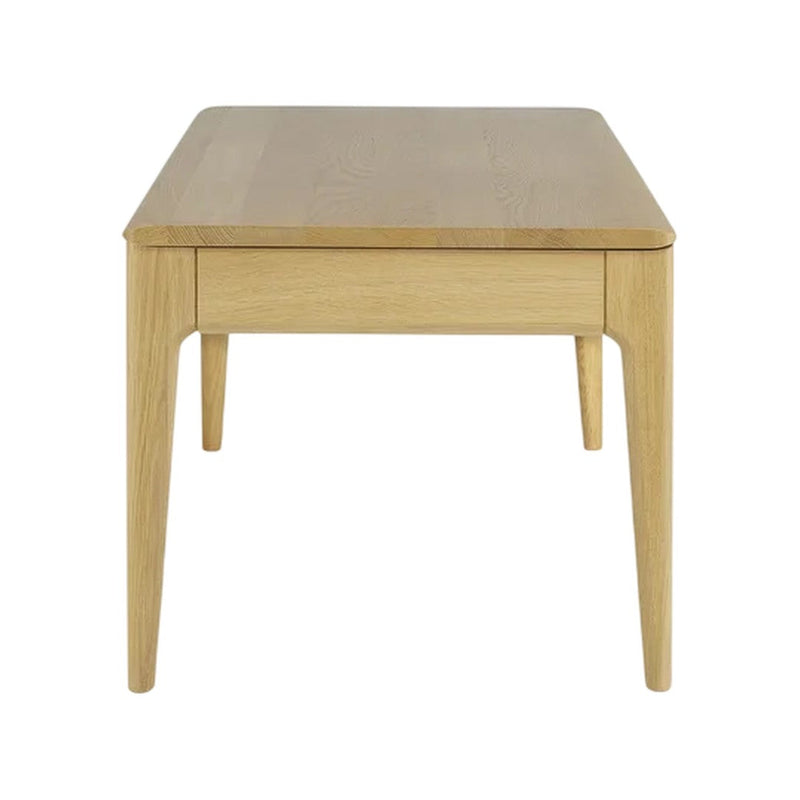 Light oak wood coffee table with a smooth, natural finish and clean lines. Contemporary design with sleek legs.