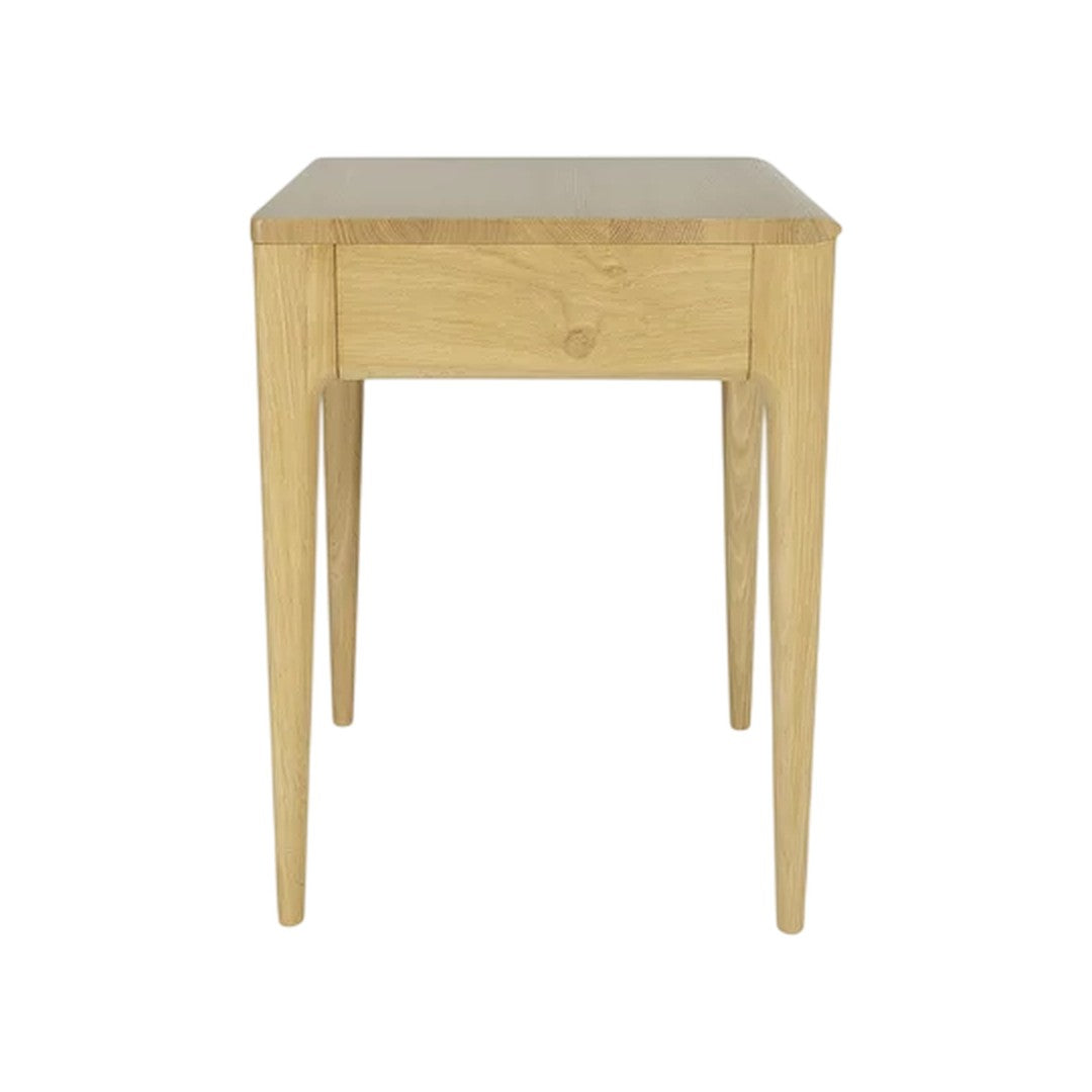 Light oak bedside table with a smooth finish and natural wood grain pattern, featuring tapered legs and a minimalist design.