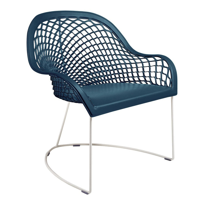 Teal mesh chair with a modern grid pattern and sleek white metal legs for contemporary decor.