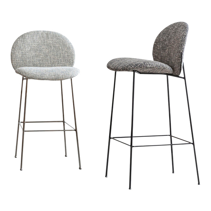 Two stylish bar stools with patterned gray upholstery and black metal legs. Modern design for contemporary spaces.