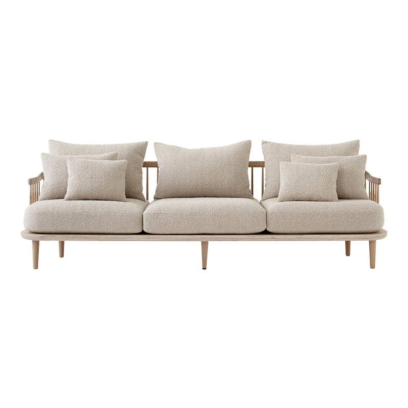 Neutral beige sofa with a smooth fabric finish, featuring simple, plush pillows for added comfort and style.
