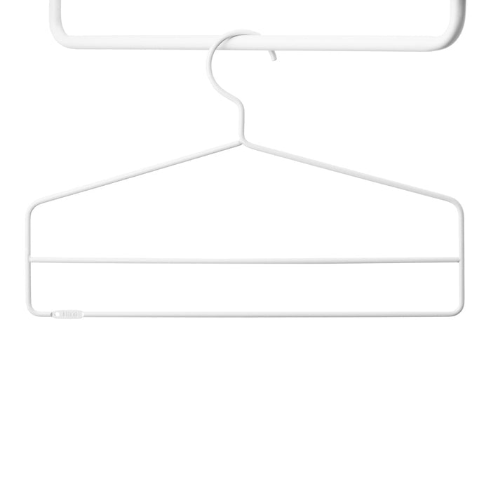 Minimalist white wire hanger with a sleek design, perfect for organizing clothes neatly.