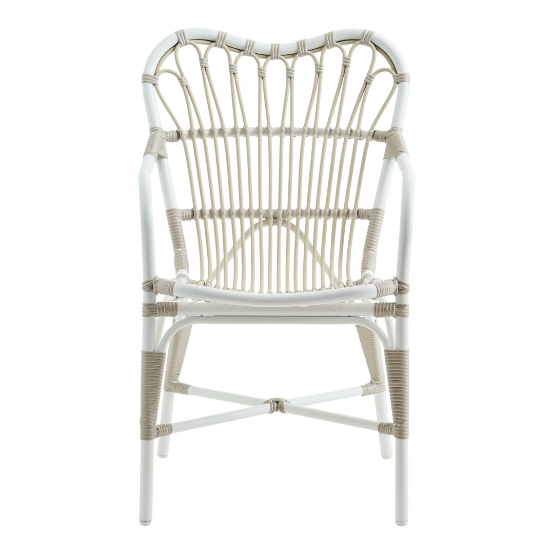 Elegant white chair with intricate beige and natural woven patterns, perfect for a stylish decor.