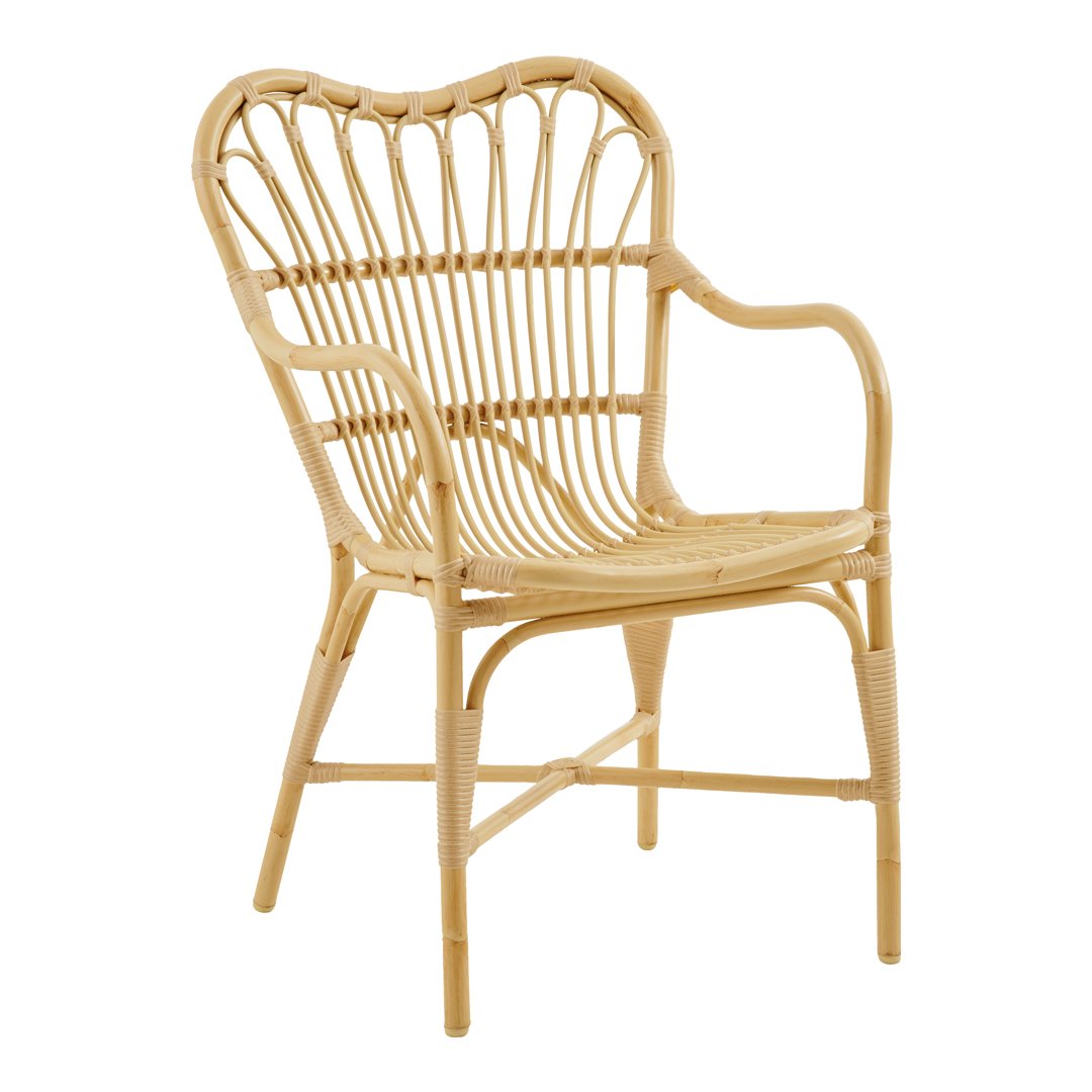 Natural rattan chair with a heart-shaped back and an open woven design, showcasing a light tan finish.