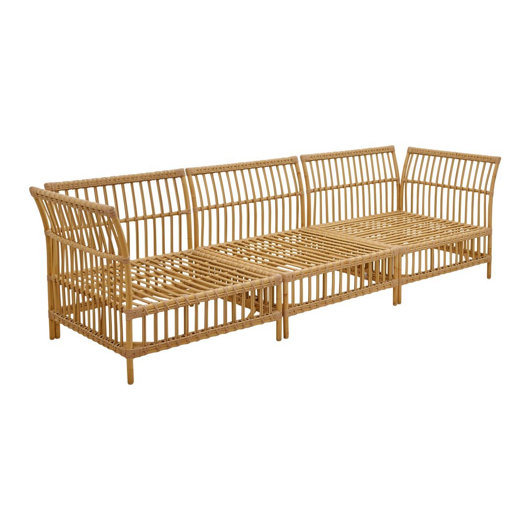 Natural rattan sofa in warm honey tones with an open slatted design, perfect for modern and bohemian decor.