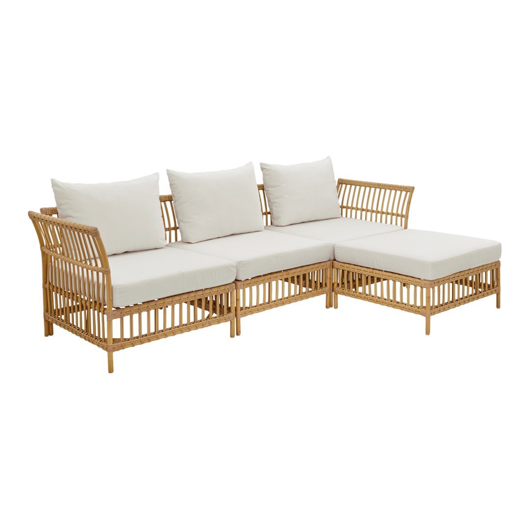 Rattan sectional sofa with beige cushions and a natural wood finish. Stylish and modern design for any outdoor space.