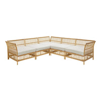 Natural bamboo corner sofa with cream cushions, featuring a sleek slatted design for a modern, airy look.