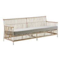 Natural rattan sofa with sleek beige cushions, showcasing a minimalist, striped pattern. Perfect for modern decor.