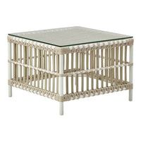 Light beige square coffee table with a slatted design and glass top, featuring intricate woven details.