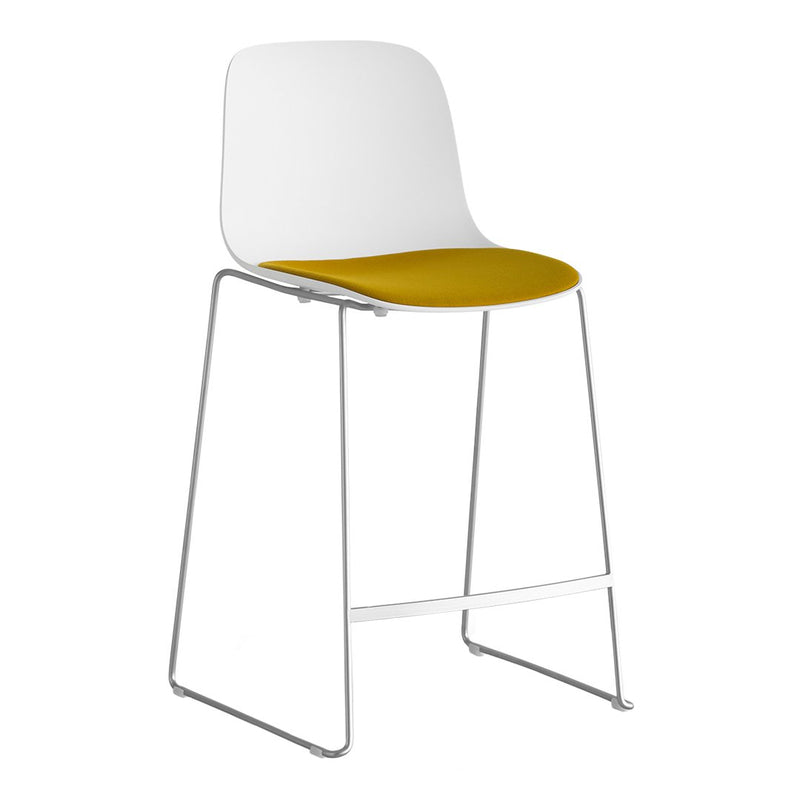 White chair with a vibrant yellow seat and sleek chrome legs, perfect for modern decor.