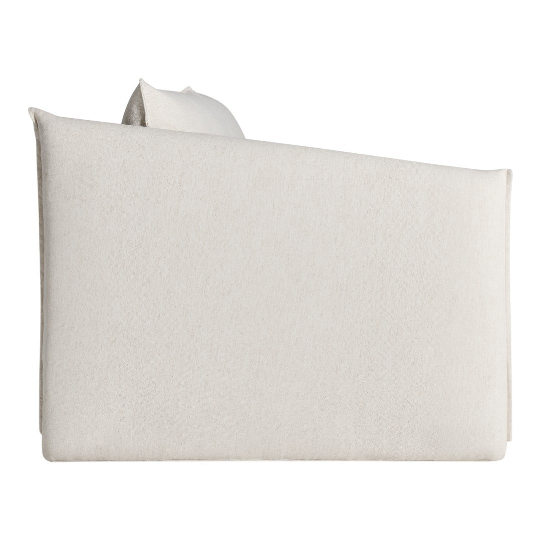 Beige upholstered sofa with a soft, textured finish, featuring a minimalist design. Perfect for modern interiors.