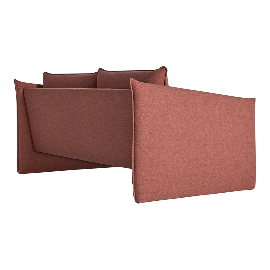 Rust-colored modern sofa with a sleek, minimalist design and soft, textured upholstery.