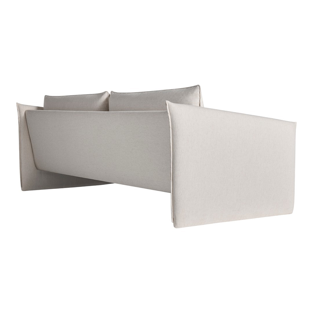 Beige fabric sofa with a sleek, minimalist design and smooth texture, featuring soft, neutral tones.