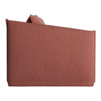 Rust-colored sofa with a soft, textured fabric and minimalist design, perfect for contemporary decor.