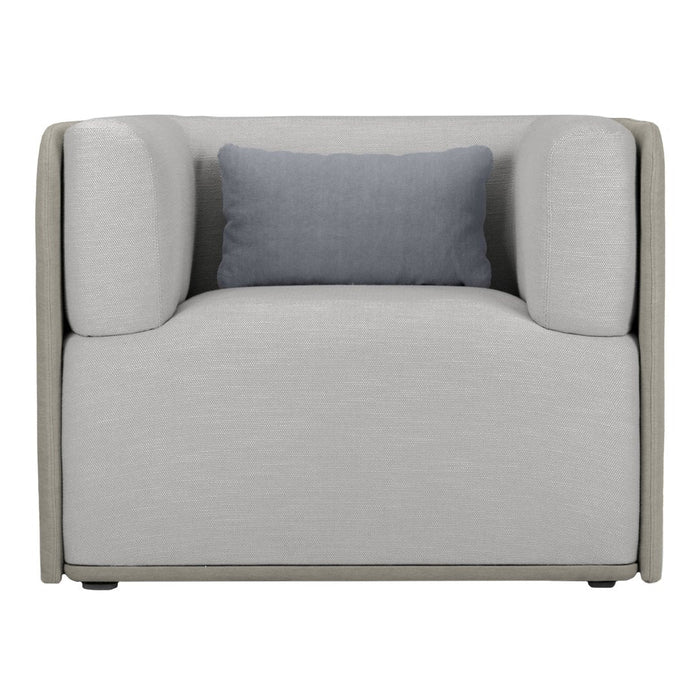 Stylish gray armchair with a light gray fabric and contrasting dark blue cushion for modern decor.