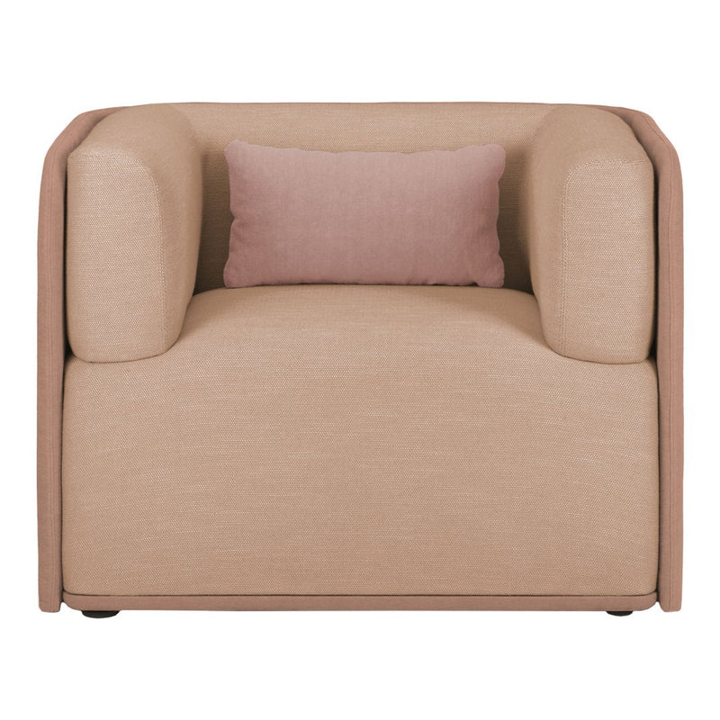 Beige armchair with subtle textured pattern and a soft pink accent pillow. Modern, minimalist design.