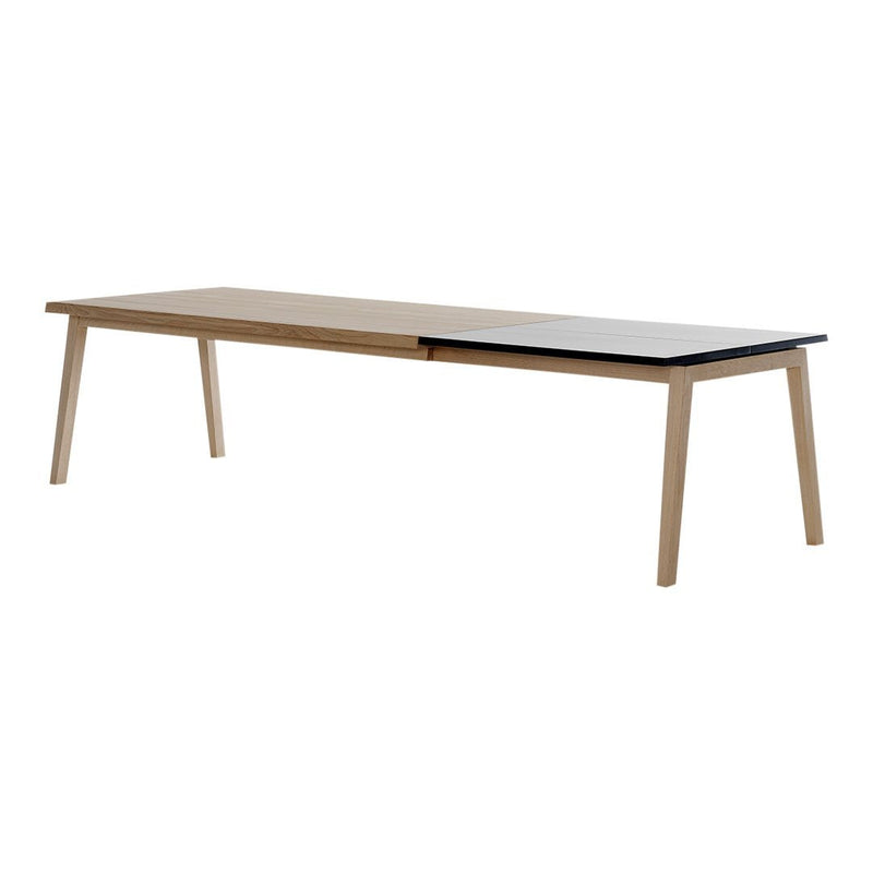 Light wood table with contrasting dark wood accents and a sleek, minimalist design. Perfect for modern spaces.