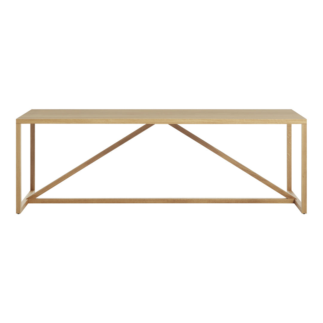 Natural wood console table with a light beige finish and simple, clean lines. Features a geometric pattern in the frame.