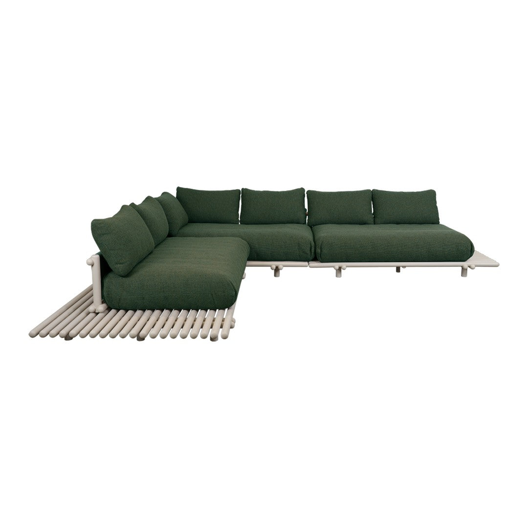 "Modern sectional sofa in deep green fabric with a sleek beige frame and minimalist design."
