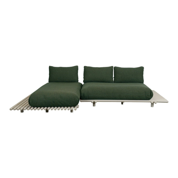 Stylish modern sofa in deep green fabric with sleek neutral base and clean lines for contemporary decor.