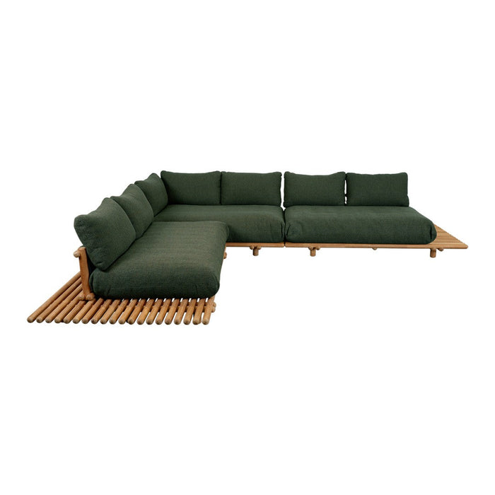 Stylish outdoor sectional sofa in deep green fabric with natural wood accents and slatted base.