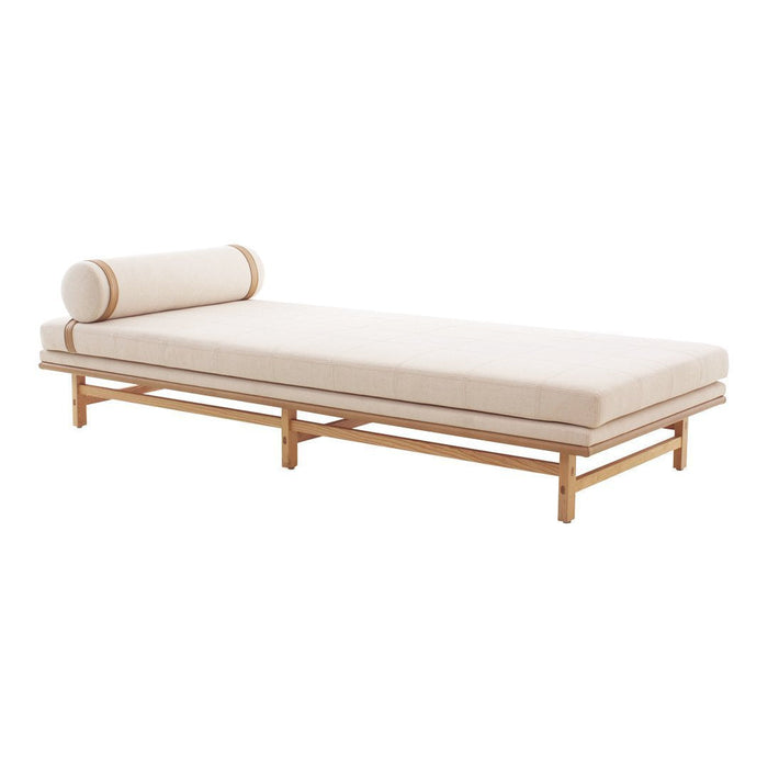 Light beige fabric daybed with a natural wood frame and matching round bolster cushion. Minimalist and modern design.