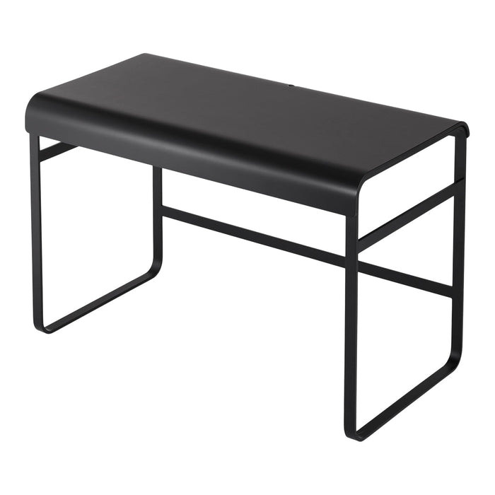 Black minimalist desk with a sleek, smooth surface and geometric metal frame. Perfect for modern interiors.