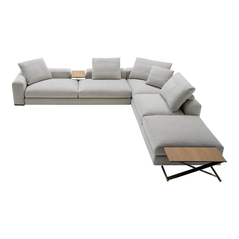 Light gray sectional sofa with plush cushions and a wooden side table, featuring a modern, minimalist design.