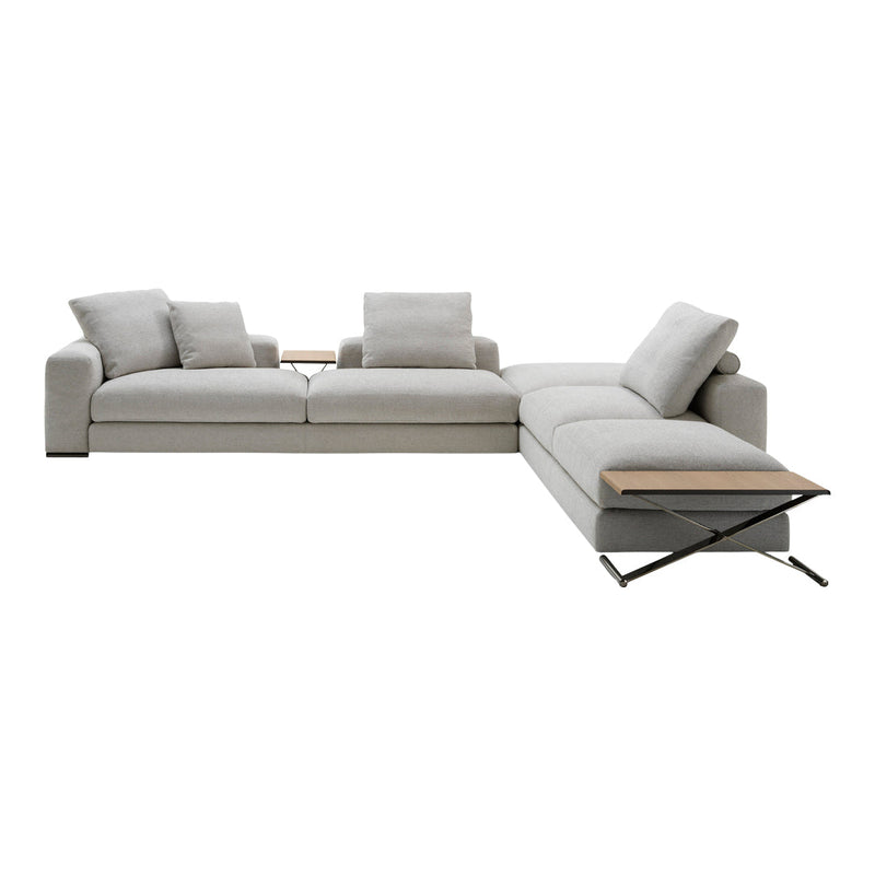 Light gray sectional sofa with a smooth fabric texture and minimalist design, featuring soft cushions and wooden accents.