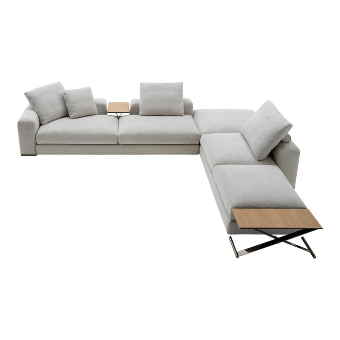 Light gray sectional sofa with soft fabric and natural wood accent table. Modern design with plush cushions.