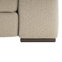 Textured beige upholstery with subtle flecks, complemented by a dark brown wooden accent.