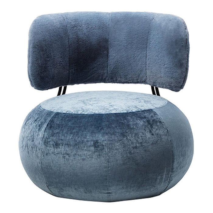 Plush blue velvet chair with a rounded seat and curved backrest, featuring a soft, modern design.