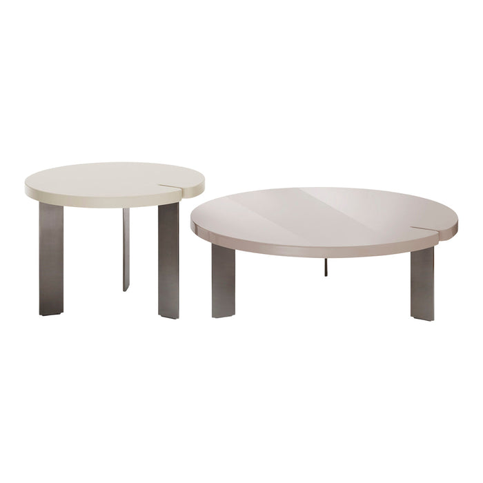 Set of two round coffee tables in soft beige and light taupe with sleek, modern metal legs. Elegant minimalist design.
