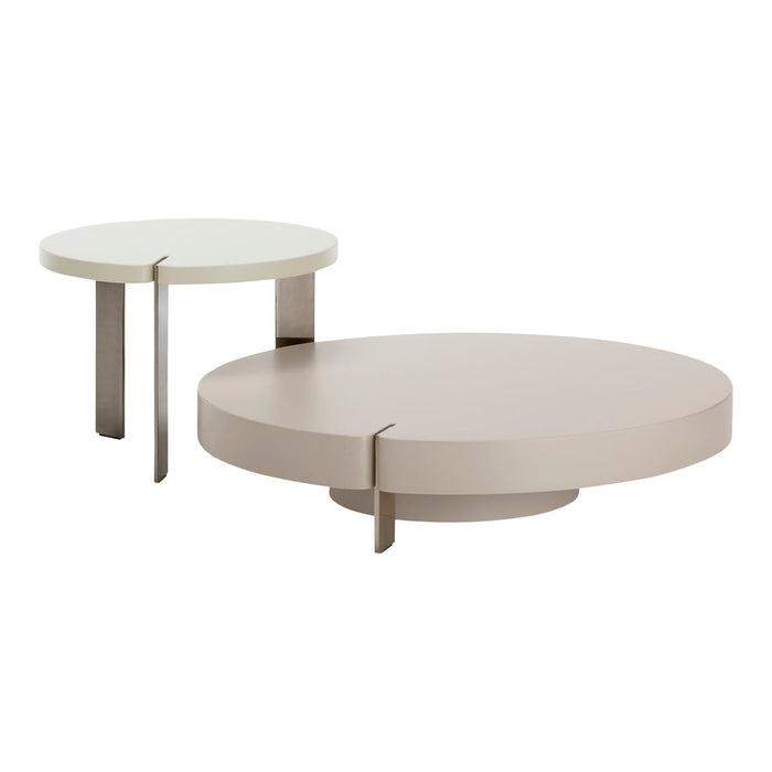 Set of two modern round coffee tables in soft beige and off-white colors with sleek, minimalist designs.