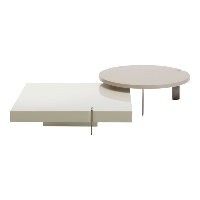 Modern coffee tables in glossy white and soft beige, featuring sleek geometric shapes and minimalistic design.