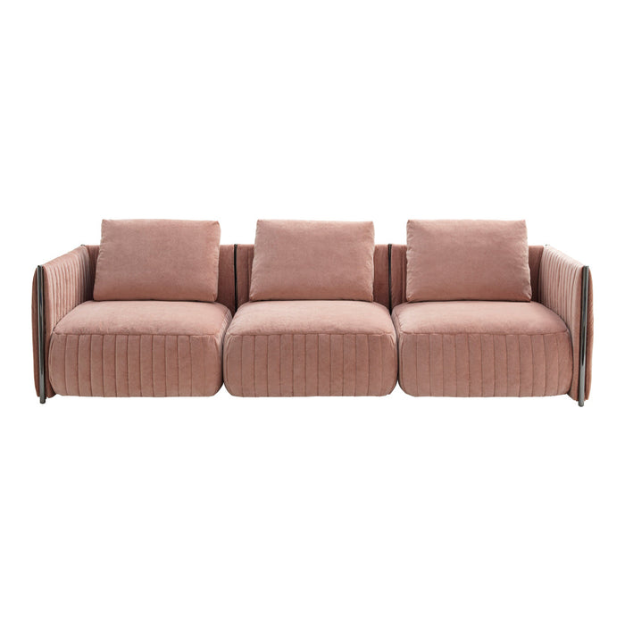 Blush pink velvet sofa with tufted design and soft, rounded edges for a modern, cozy look. Perfect for chic interiors.